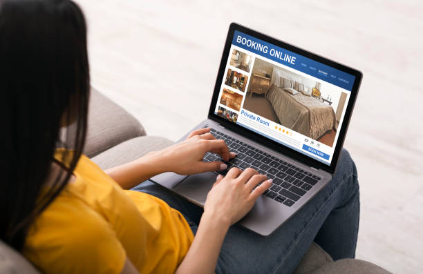 istock Girl checking on hotels online, using laptop 1255186072