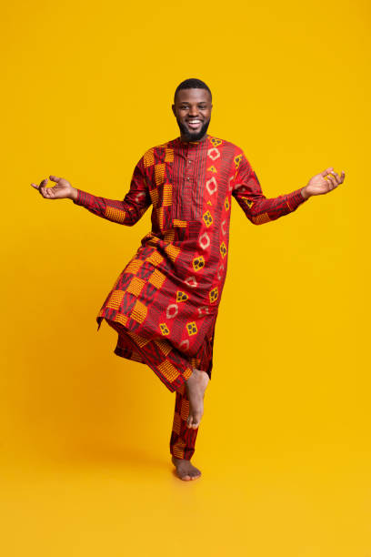 istock Happy african man standing on one leg, meditating 1255188323