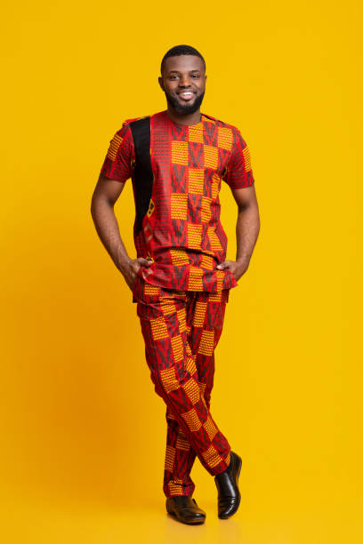 istock Confident african man in authentic costume posing over yellow 1255188853