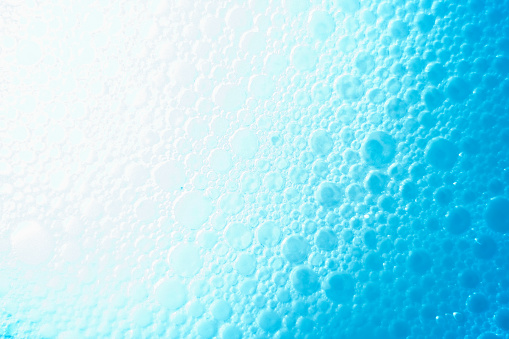 abstract background with bubbles soap on the water surface
