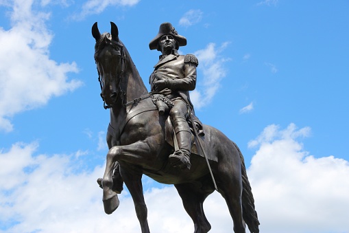 Public space view of Washington Monument at Public Garden in Boston. The sculpture was commissioned in 1859, and cast and dedicated in 1869. It was made by artist Thomas Ball.