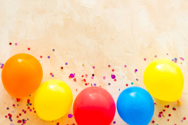 istock Flat lay with ballons - party concept - on beige background top-down copy space 1255190410