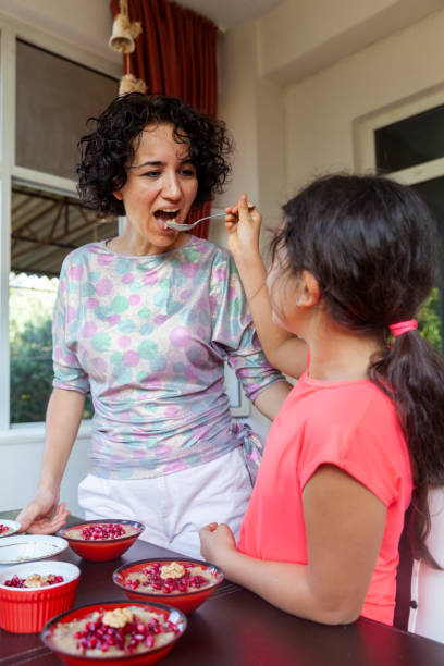 istock Child feeds the mother to ashura 1255191675