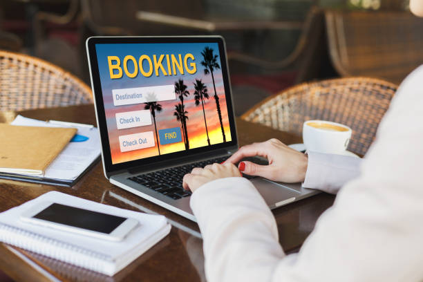 istock Unrecognizable businesswoman planning her vacation while sitting at cafe 1255196523