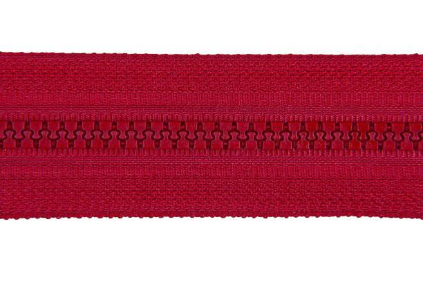 istock Closed red zipper isolated on white background. Red zipper for tailor sewing. 1255196637