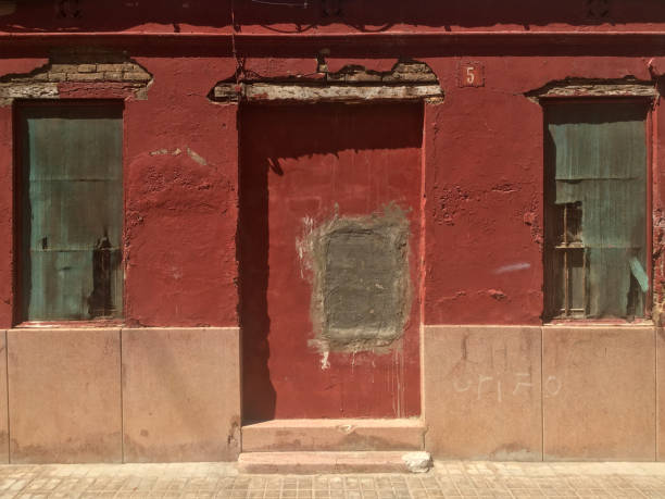 istock Blocked door of old house 1255202451