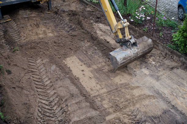 istock leveling the ground by an excavator on the construction site 1255204303