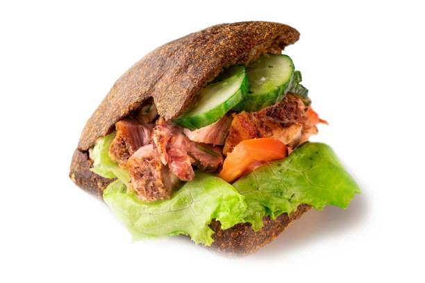 istock sandwich with meat and a dark bun on an isolated background 1255208065