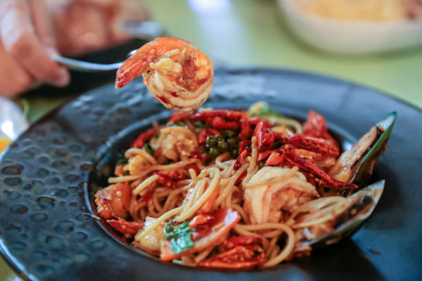 istock Spaghetti with Spicy prawn and Mixed Seafood, focus selective. 1255208152