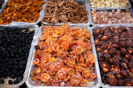 Close-up of various dried fruits for sale at Donghuamen night market, on the Wangfujing street, Beijing, China