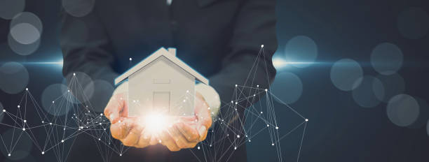 istock Businessman holding home model,with automation assistant technology and innovation internet online digital line network,concept futuristic smart home and technology remote devices control system 1255209459