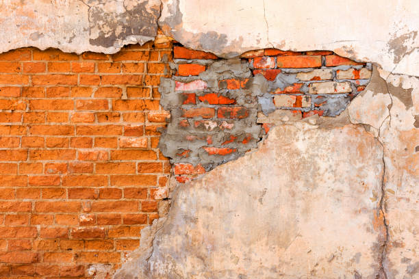 istock Abstract background old white brick wall with cracks and scratches. Landscape style. Great background or texture. 1255210918