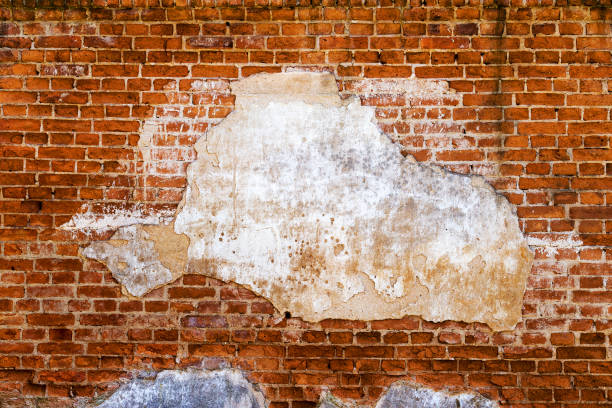 istock Abstract background old white brick wall with cracks and scratches. Landscape style. Great background or texture. 1255211075