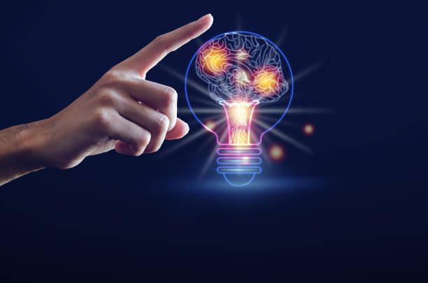 istock Light bulb with brain, finger of person touching on head brain and point connecting network on blue background. Creative The brain in the light bulb, The concept of the business idea. 1255211391