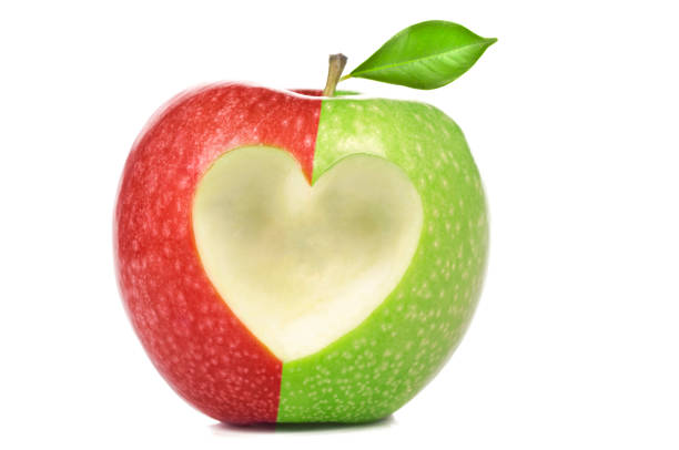 fresh red apple with heart symbol
