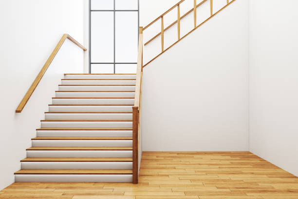 istock Minimalistic concrete hall interior with stairs, wooden floor and window. 1255213162