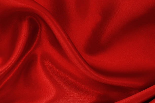 istock Dark red fabric cloth texture for background and design art work, beautiful crumpled pattern of silk or linen. 1255213223