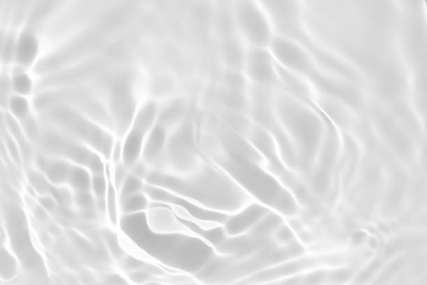 istock desaturated transparent clear calm water surface texture 1255213305