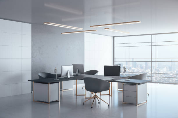 istock Contemporary coworking office interior with personal computers 1255213354