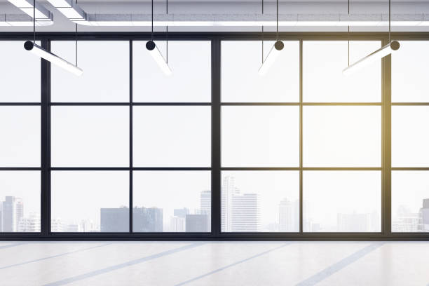 istock Modern office hall with concrete floor and city view background. 1255213382