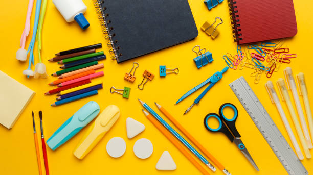 istock Back to school, items on yellow background. Welcome to learning. Sale accessories for knowledge, retail. Study shopping 1255213521