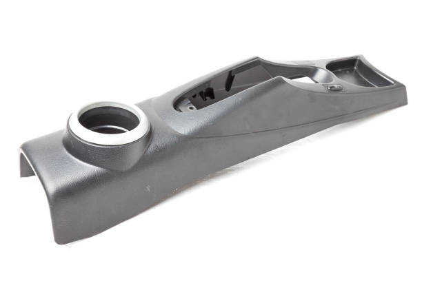 istock Dismantled car center console on a white background in a photo studio gray plastic panel with cup holders - spare part for sale at an auto-parsing or replacement during repair. 1255214408