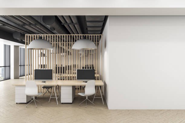 istock Minimalistic coworking office interior with blank wall 1255215642
