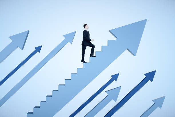 istock Businessman climbs stairs in form arrow 1255216588