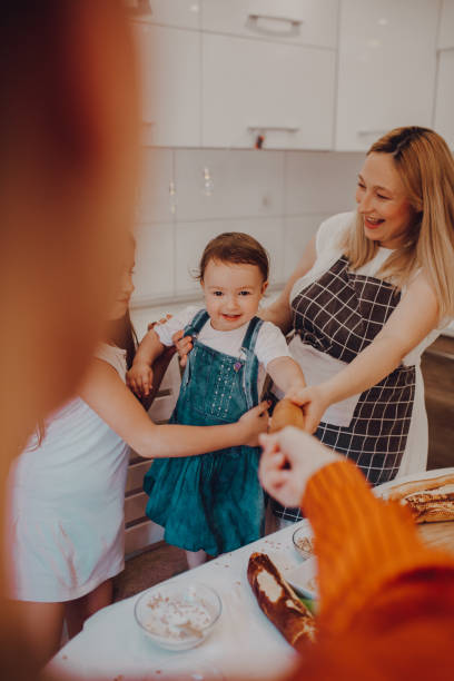 istock Family making cookies in kitchen 1255220614