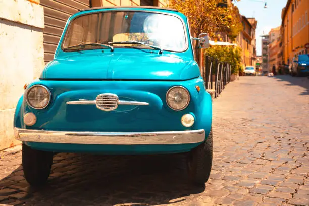Vintage Fiat 500 classic italian car parked Trastevere, Rome, Italy