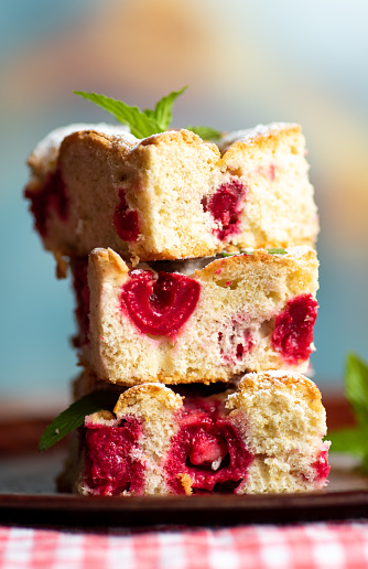 Tasty chocolate cake with butter cream and strawberry toppings