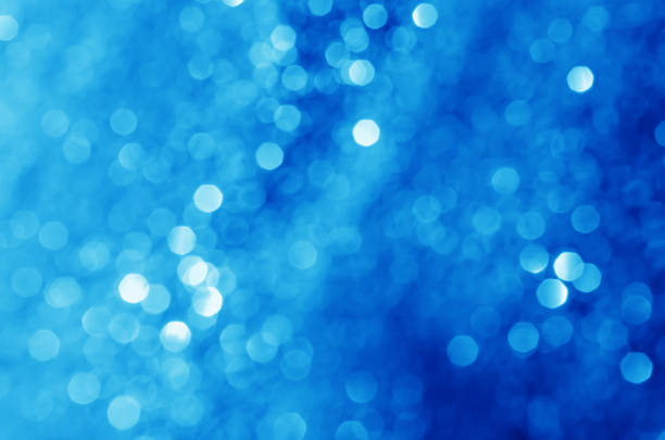 istock glitter light sparkle blue gorgeous bokeh defocused abstract background shiny. 1255226879