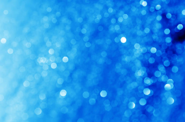 istock glitter light sparkle blue gorgeous bokeh defocused abstract background shiny. 1255226899