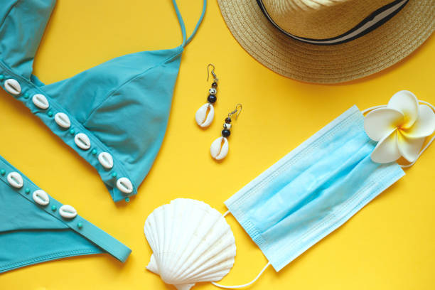 istock set of summer beach accessories on a yellow background 1255230067