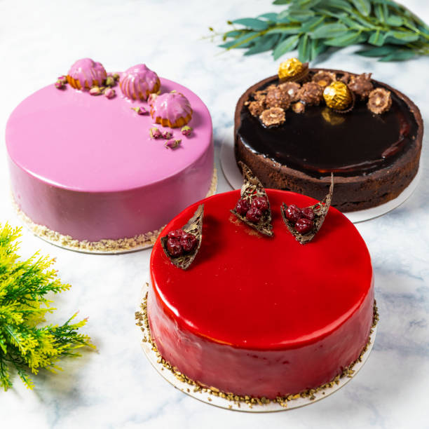 istock Different beautiful colorful cakes on the white table 1255231963