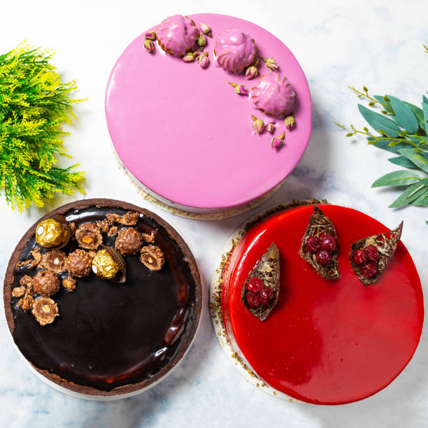 istock Different beautiful colorful cakes on the white table, 1255231988