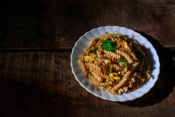 istock pasta with tomato sauce and vegetables in bowl. Top view. Flat lay 1255233649