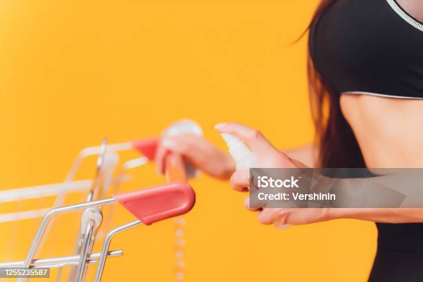 Girl Wearing A Mask To Protect Against Germs And Viruses Pushing The Trolley Stock Photo - Download Image Now