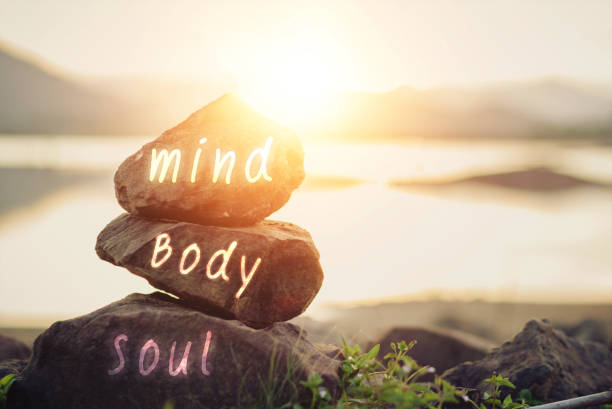 body, mind, soul, spirit Holistic health concept of zen stones / Concept body, mind, soul, spirit health farm stock pictures, royalty-free photos & images