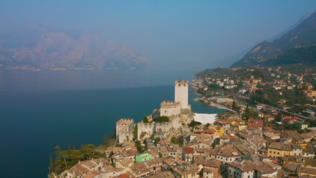 AERIAL WS Town on Lake Garda / Italy
