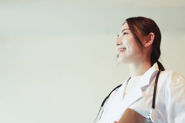 Portrait of Asian Doctor in office Portrait of Young Asian female doctor in Office japanese female doctor stock pictures, royalty-free photos & images