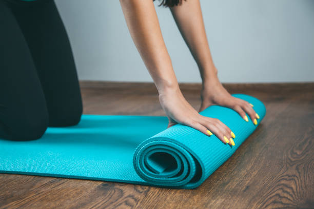 istock woman and carpet for training 1255238354
