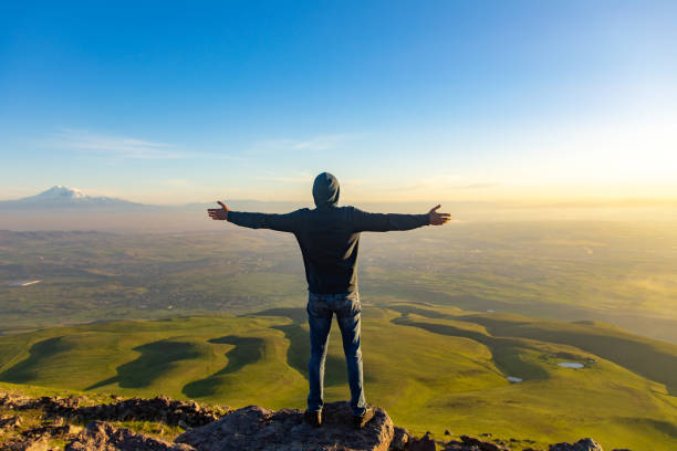 istock happy man in the mountain 1255238363