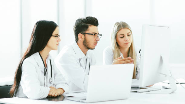 istock group of medical experts discussing online information 1255242684