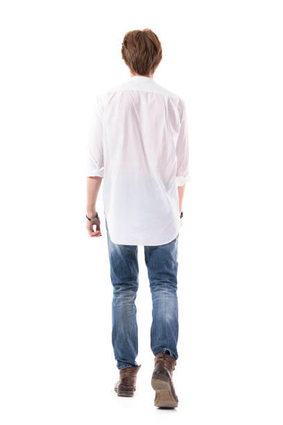 istock Unrecognizable young red hair stylish man walking away looking ahead. 1255242749