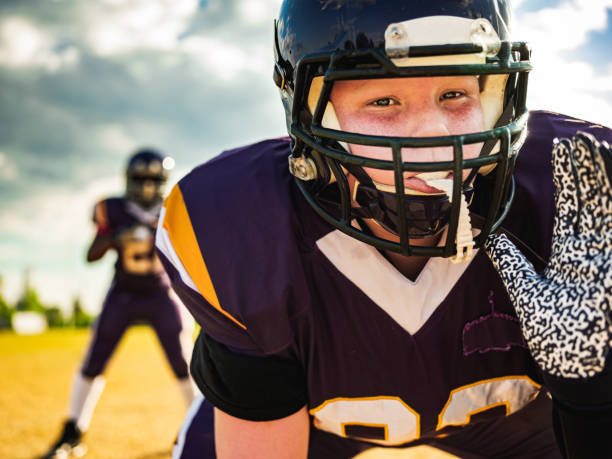istock Junior Football players during game 1255242906
