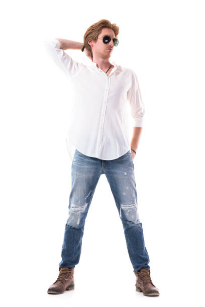 istock Thoughtful young stylish handsome man looking away scratching head confused 1255243133