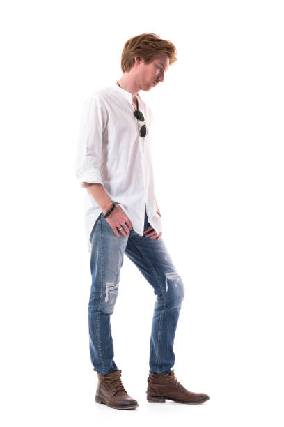 istock Side view of sad disappointed young casual man looking down with bowed head. 1255243801