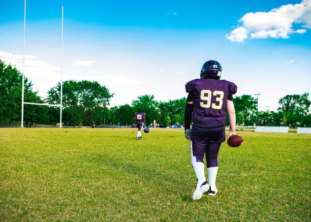 istock Junior Football players getting ready 1255244205