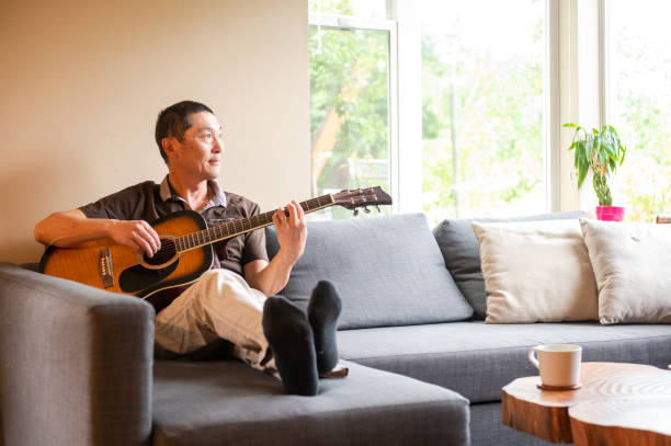 Japanese man playing guitar